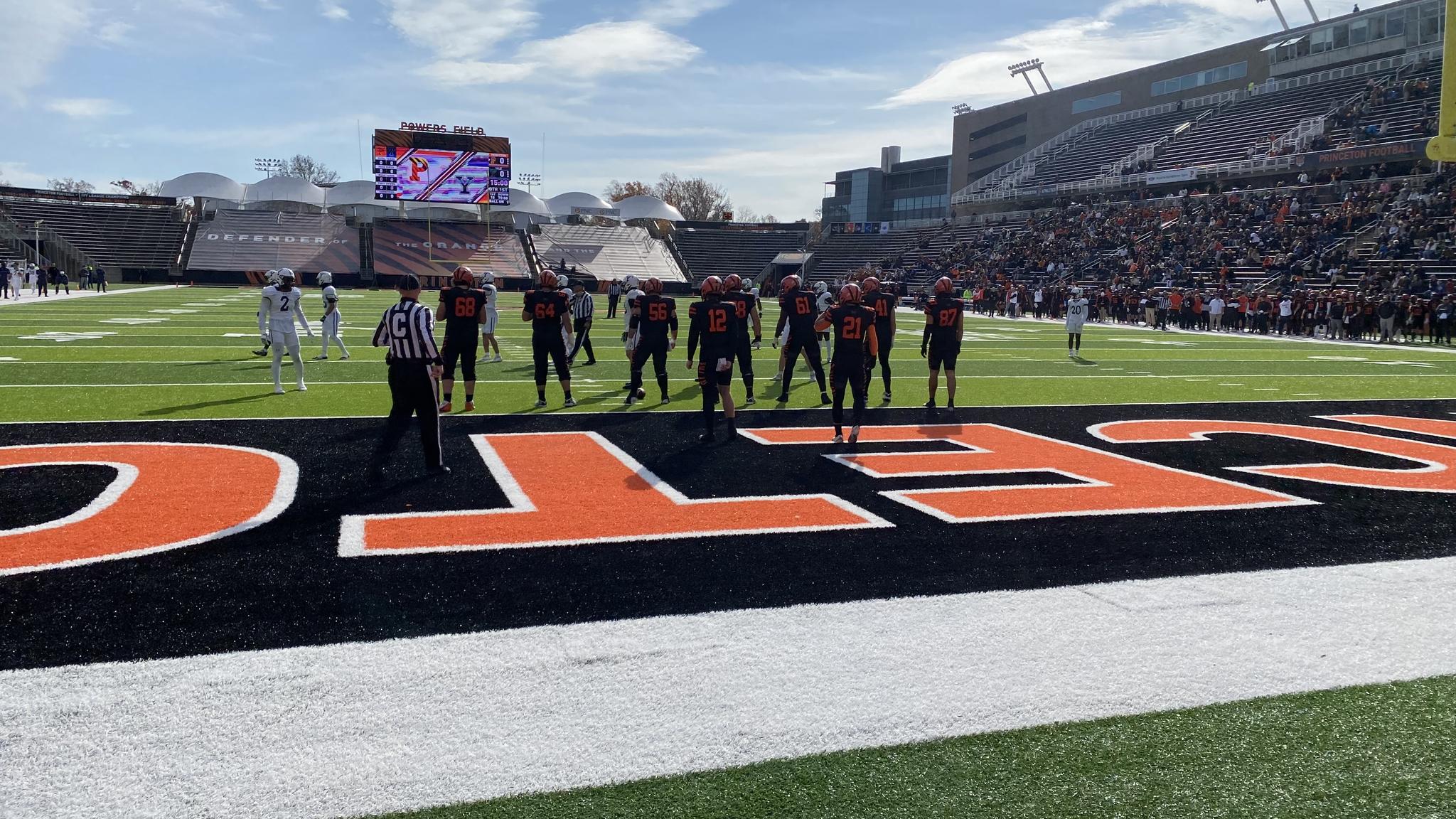 An image of a play during a football game taken from the first row of the stadium
