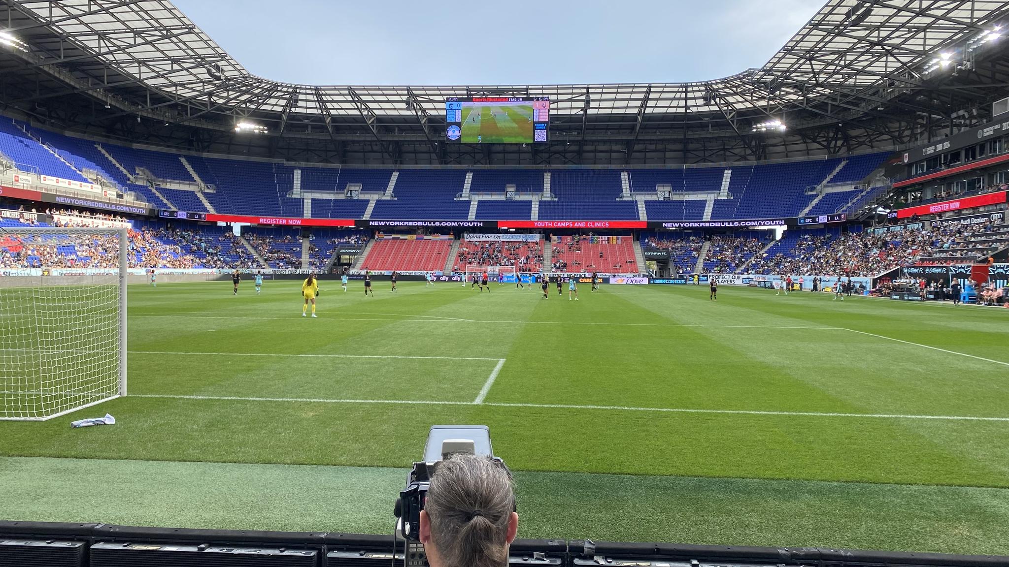 A photo taken from the front row of the stands during a Gotham FC match