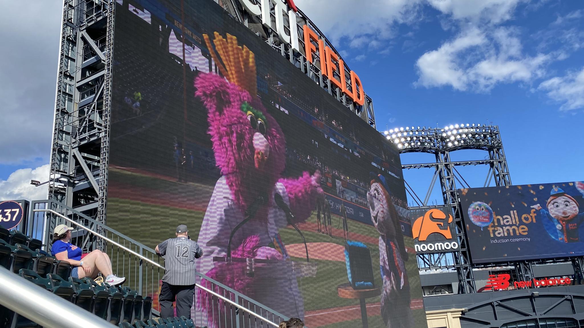 A photo of a video of a mascot giving a speech at Citi Field