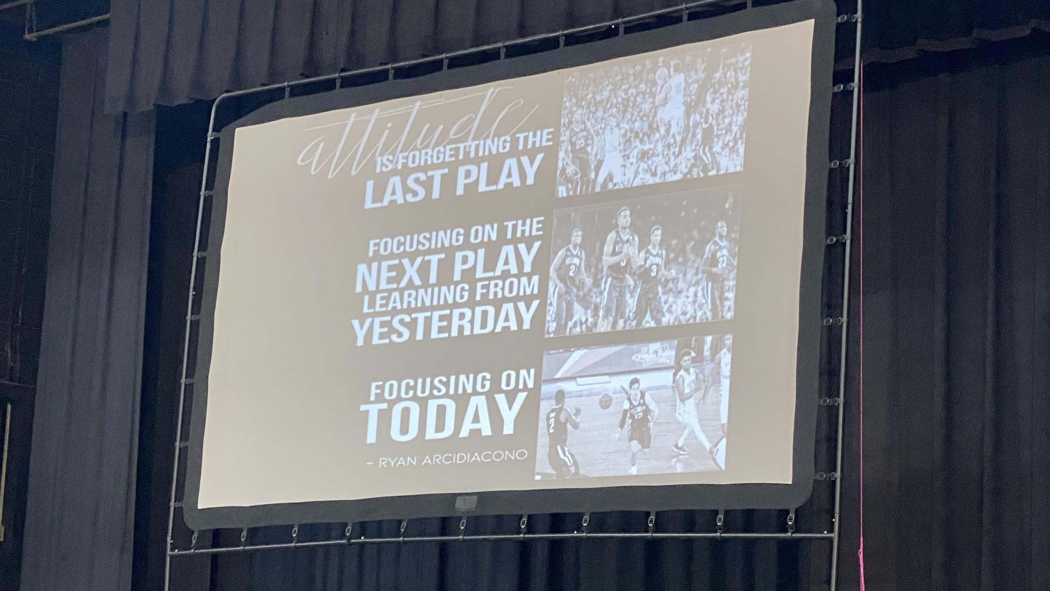 A photo of a slide from Jay Wright's presentation. It says "Attitude is forgetting the last play, focusing on the next play, learning from yesterday, focusing on today"
