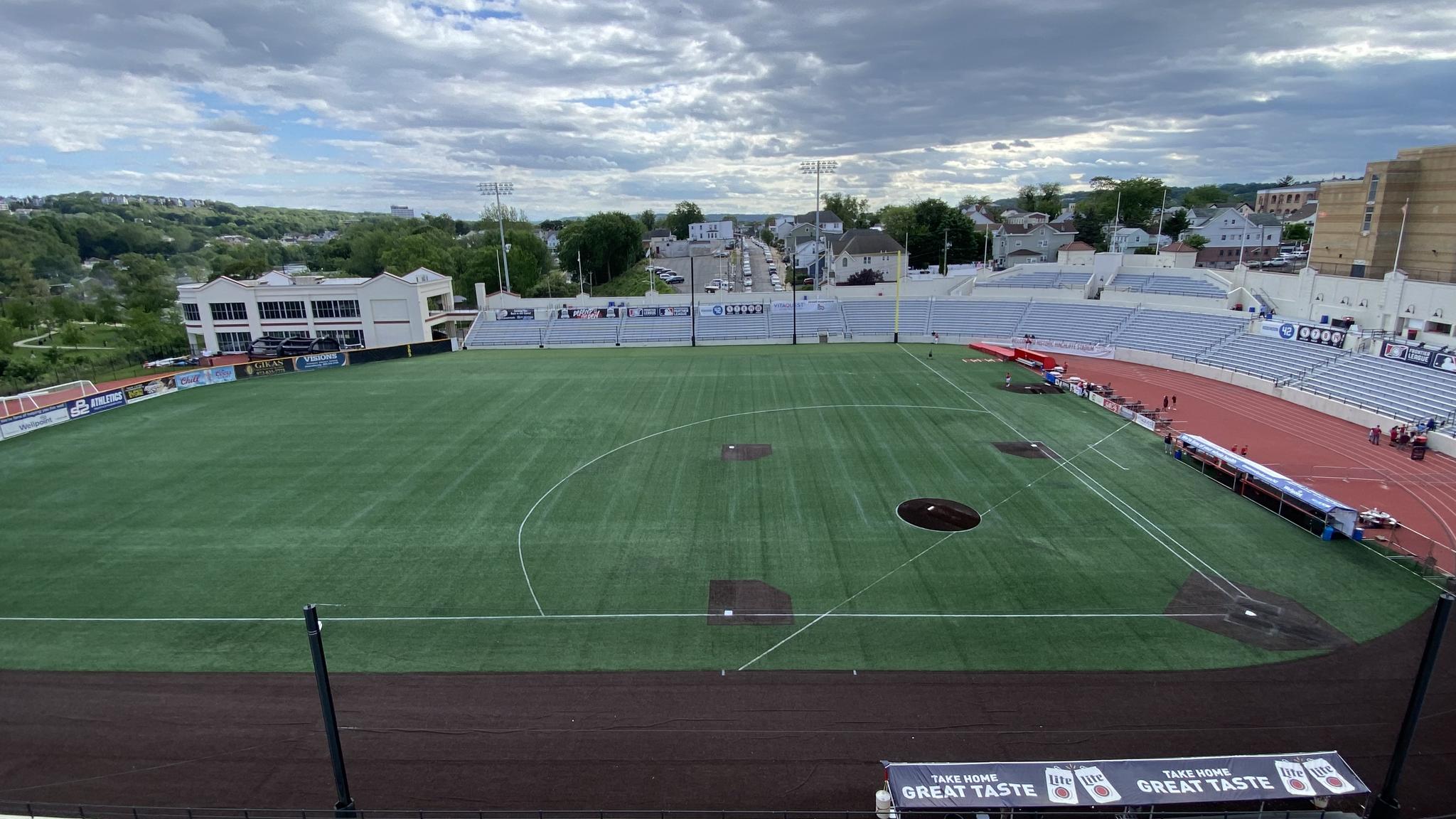 A view of Hinchliffe Stadium from atop the parking garage. Despite the stadium not selling alcohol, a beer advertisement can be seen near the field.