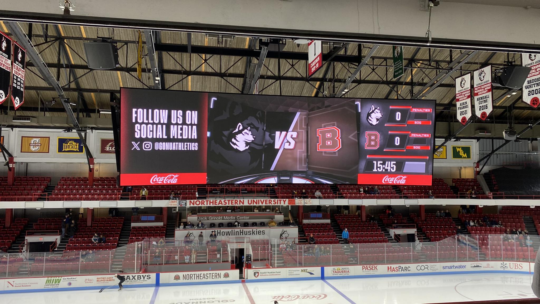 An image of the large video board that hangs in Matthews Arena