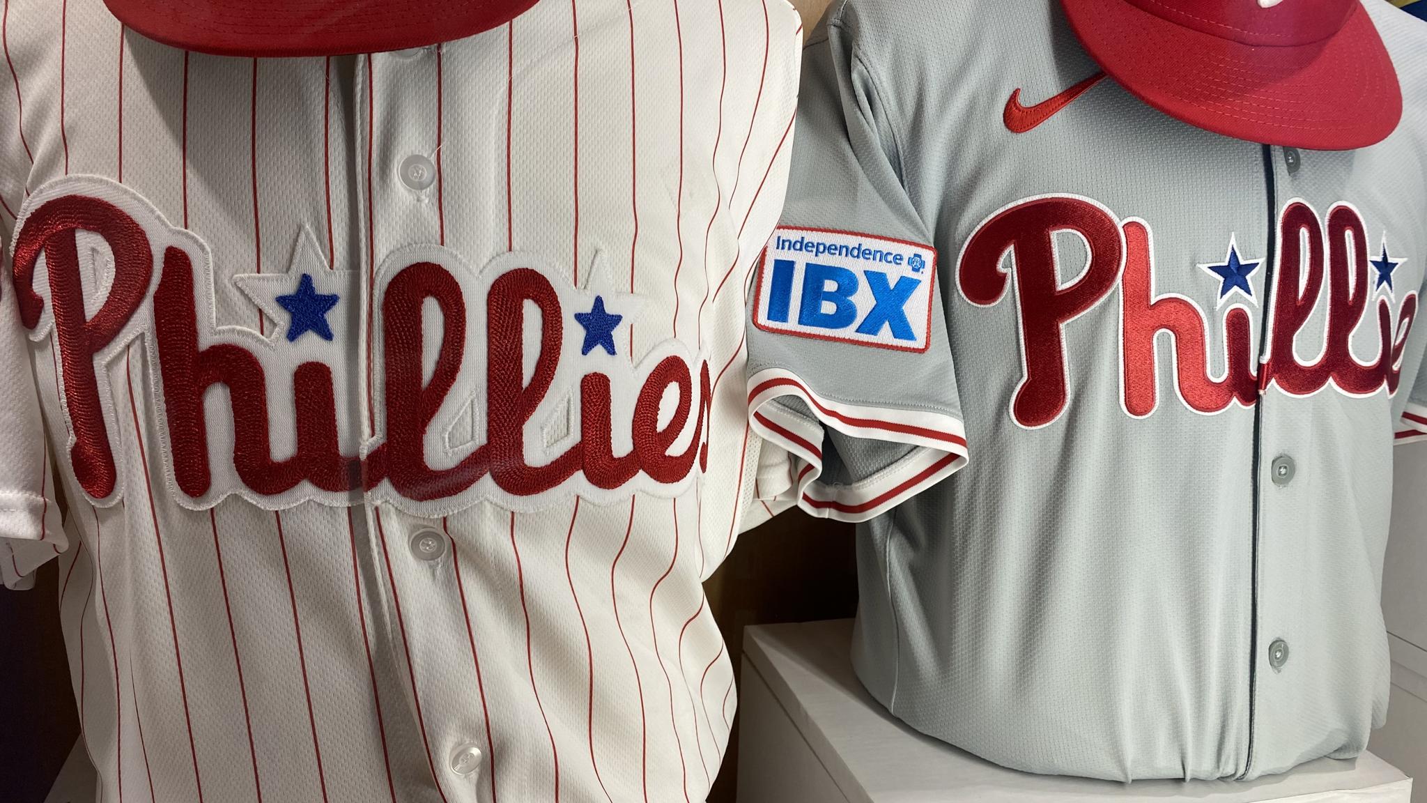 An image of two Phillies jerseys - one with a chain stitched script, the other without