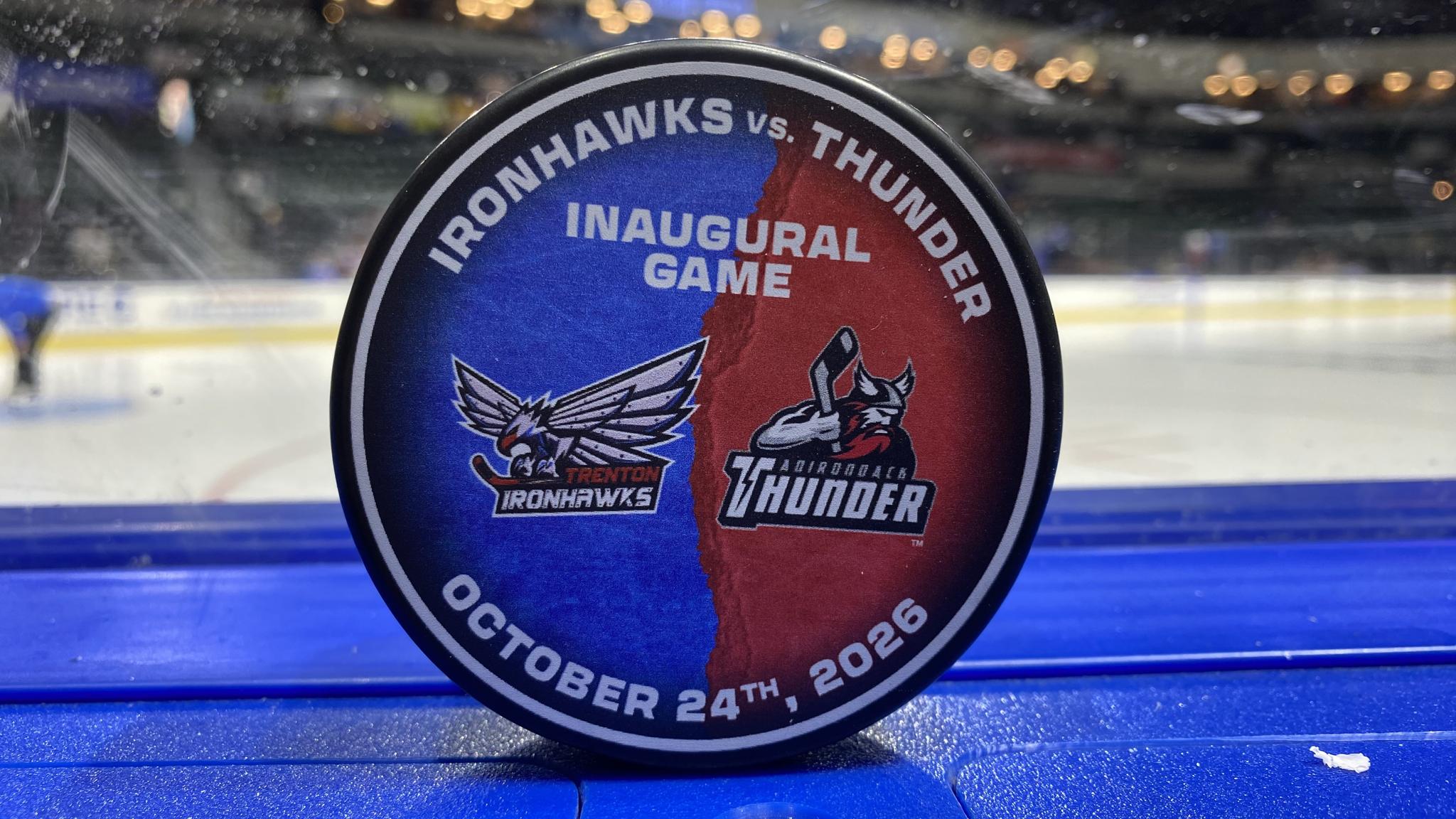 An image of a puck featuring the matchup for this game