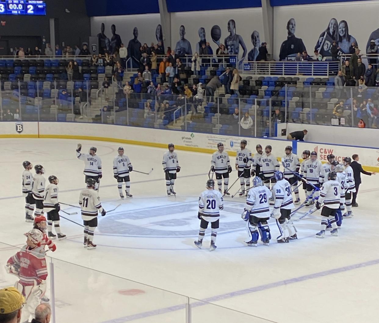 Bentley players salute the crowd after quote on quote winning